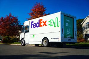 FedEx all-electric step van on a Harbinger chassis parked on a residential street