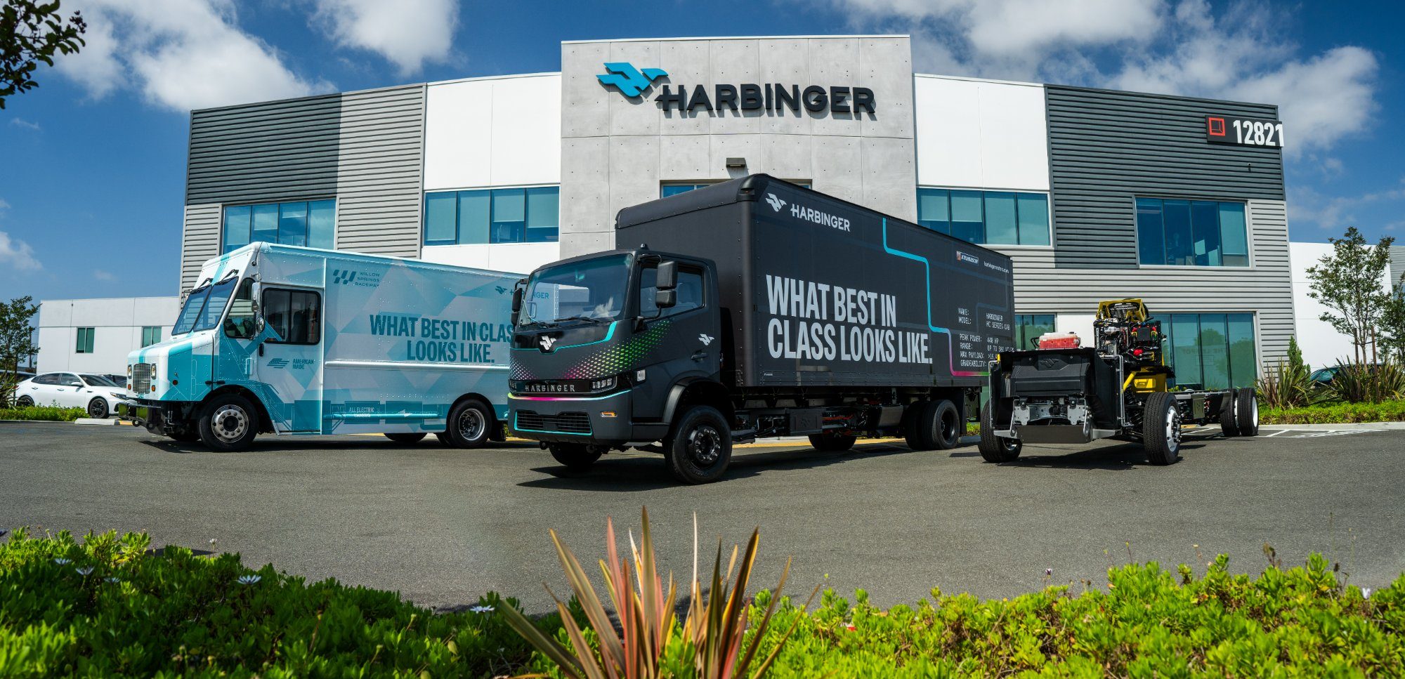 Harbinger Step Van, HC Series Cab and bare chassis in front of Harbinger headquarters